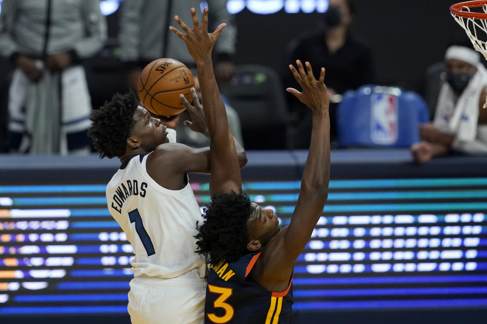 Minnesota Timberwolves guard Anthony Edwards (1) shoots over Golden State Warriors center James Wiseman during the first half of an NBA basketball game in San Francisco, Wednesday, Jan. 27, 2021. (AP Photo/Jeff Chiu)