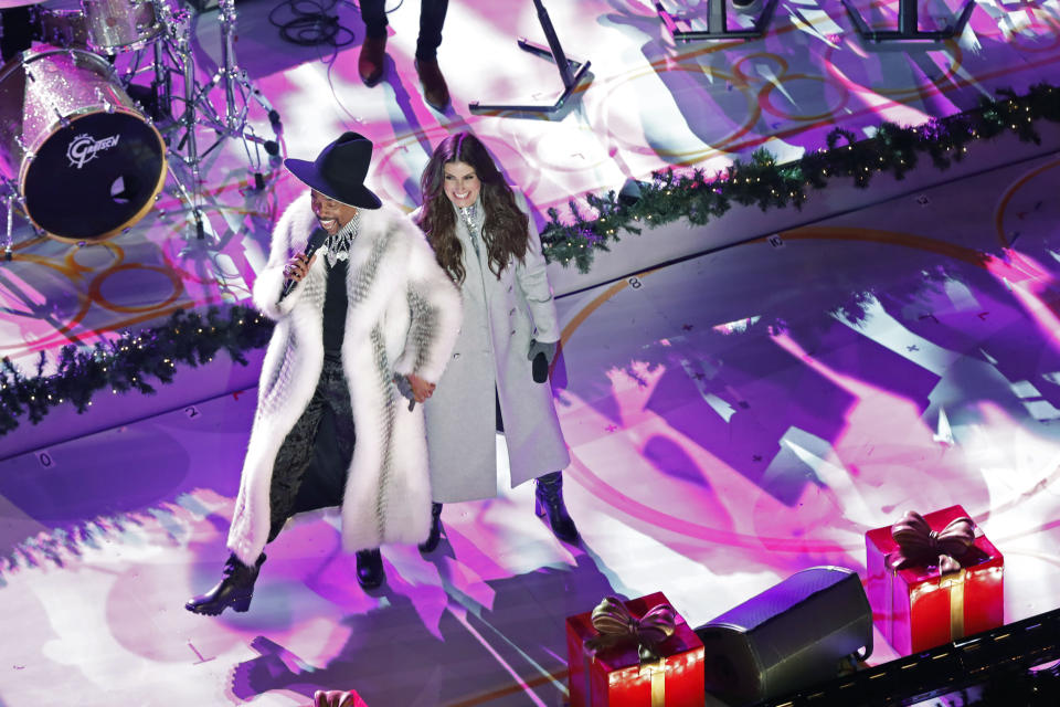 Billy Porter, left, and Idina Menzel perform during the 87th annual Rockefeller Center Christmas Tree lighting ceremony, Wednesday, Dec. 4, 2019, in New York. (AP Photo/Kathy Willens)