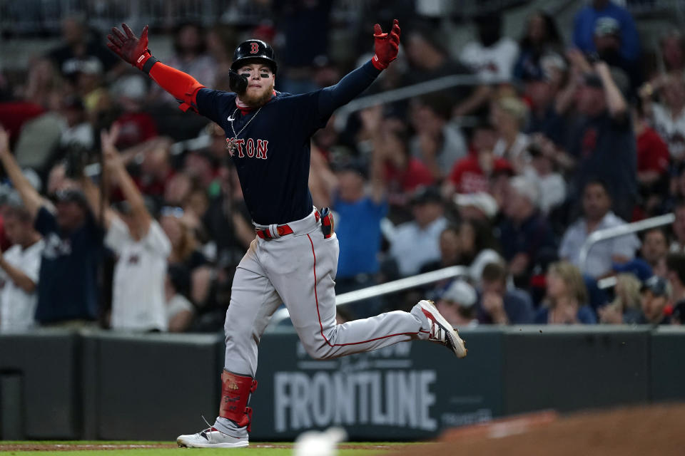 Boston Red Sox's Alex Verdugo celebrates as he runs the bases on a three-run home run during the eighth inning of the team's baseball game against the Atlanta Braves on Tuesday, June 15, 2021, in Atlanta. (AP Photo/John Bazemore)