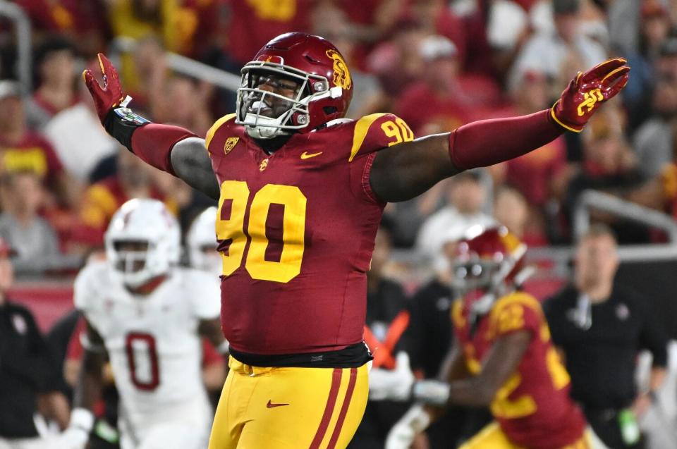 USC defensive lineman Bear Alexander celebrates after tipping a pass against Stanford in September.