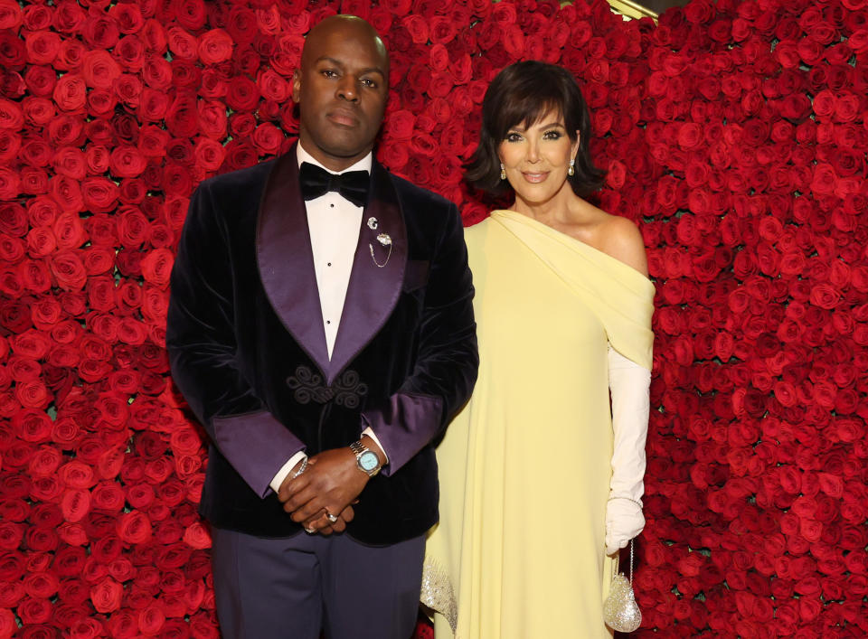 Corey Gamble and Kris Jenner stand together at a formal event