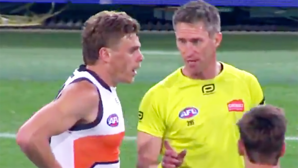 Adam Kennedy is pictured being warned by field umpire Shaun Ryan to stop targeting the injured elbow of Brisbane Lions forward Charlie Cameron. Picture: AFL/Channel 7