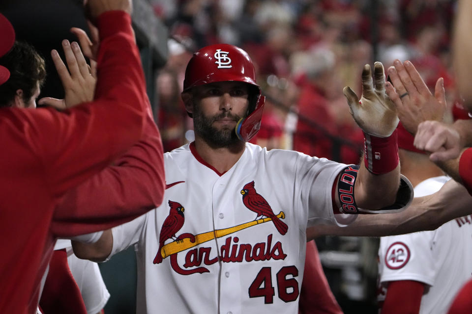 St. Louis Cardinals' Paul Goldschmidt is congratulated by teammates after hitting a solo home run during the seventh inning of a baseball game against the Atlanta Braves Monday, April 3, 2023, in St. Louis. (AP Photo/Jeff Roberson)