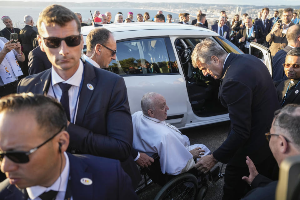 Pope Francis, centre, leaves after a moment of reflection with religious leaders next to the Notre Dame de la Garde Basilica in Marseille, France, Friday, Sept. 22, 2023. Francis, during a two-day visit, will join Catholic bishops from the Mediterranean region on discussions that will largely focus on migration. (AP Photo/Pavel Golovkin)