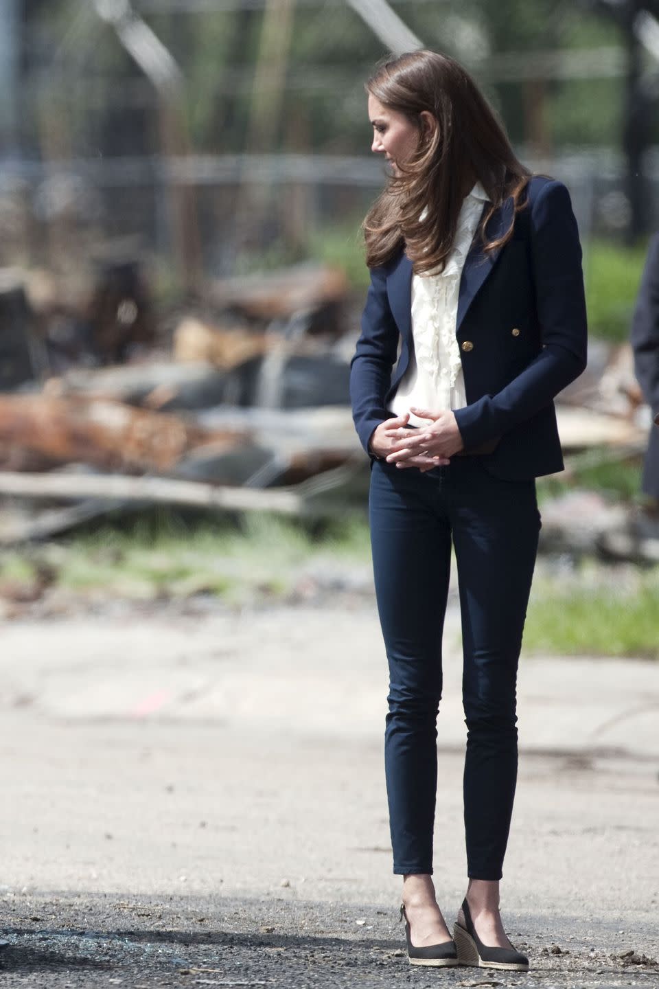 <p><em>July 7, 2011 —</em> While in Canada, Kate relied on her casual uniform of skinny jeans, a navy blazer, and slingback wedges.</p>