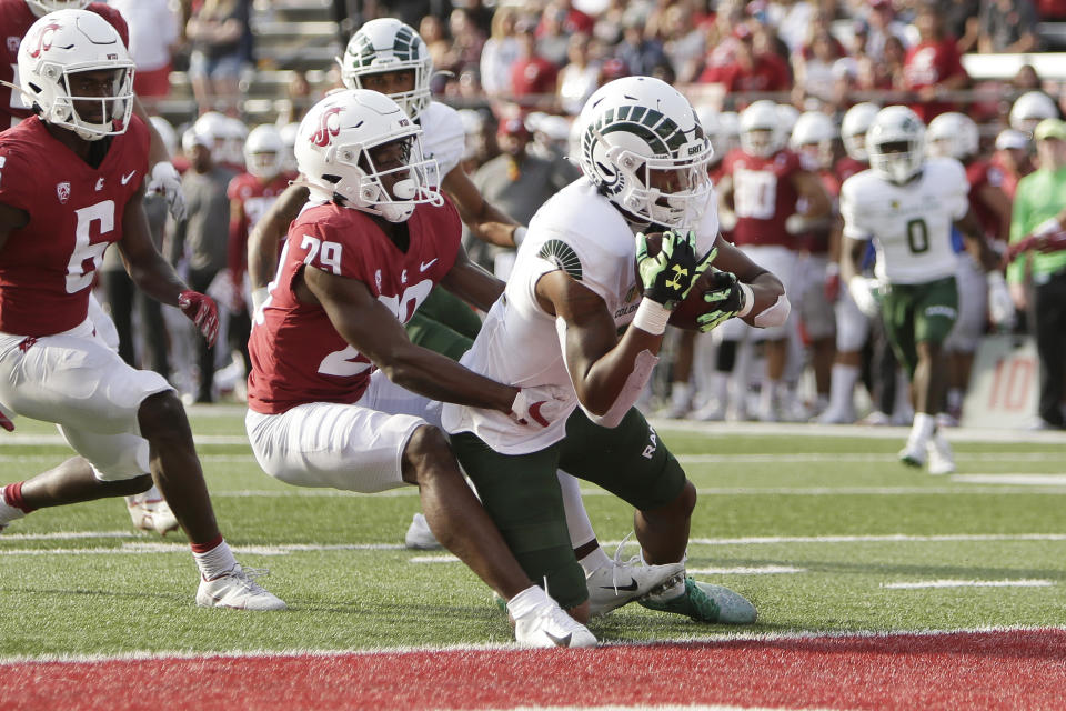 Colorado State wide receiver Justus Ross-Simmons, right, secures a pass to score a touchdown while defended by Washington State defensive back Cam Lampkin during the second half of an NCAA college football game, Saturday, Sept. 17, 2022, in Pullman, Wash. Washington State won 38-7. (AP Photo/Young Kwak)