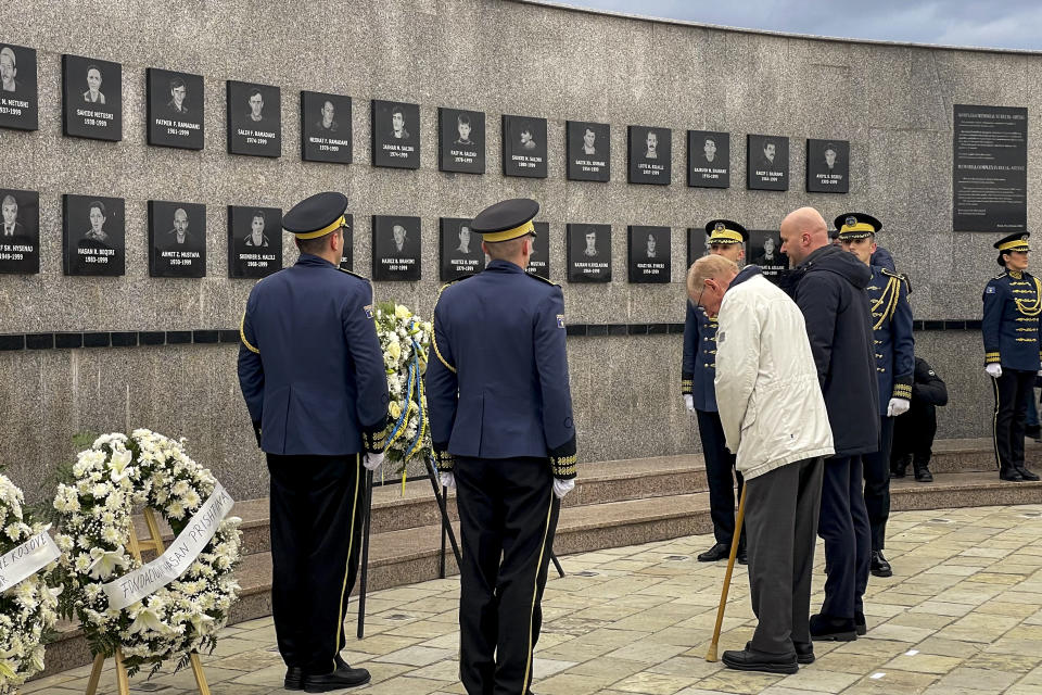 Former U.S. diplomat William Walker, 88, left, pays his respects at a memorial for Kosovars killed in 1999 by Serb forces in Recak, Kosovo, Monday, Jan. 15, 2024. Hundreds of Kosovars have gathered in a southern village to commemorate the 25th anniversary of the mass killing of 45 ethnic Albanians by Serb forces which was a decisive moment to spark international anger and prompt a 78-day U.S. and NATO air campaign to end Kosovo's 1998-99 war.(AP Photo/Zenel Zhinipotoku)