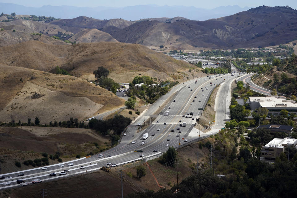 FILE - An overview of the Wallis Annenberg Wildlife Crossing, which will eventually be built over the 101 freeway, Tuesday, Sept. 20, 2022, in Agoura Hills, Calif. While the prospect of attacks on people is frightening, the truth is humans kill more cougars than the other way around. Mountain lion deaths on California roadways are a common occurrence, and are tracked as part of a two-decade study of the animals by the National Park Service. (AP Photo/Marcio Jose Sanchez,File)