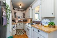 <p><span>35 San Jose Ave., Victoria, B.C.</span><br> While the home still maintains much of its original character, updates have been made to it throughout the years, including the kitchen.(Photo: Zoocasa) </p>