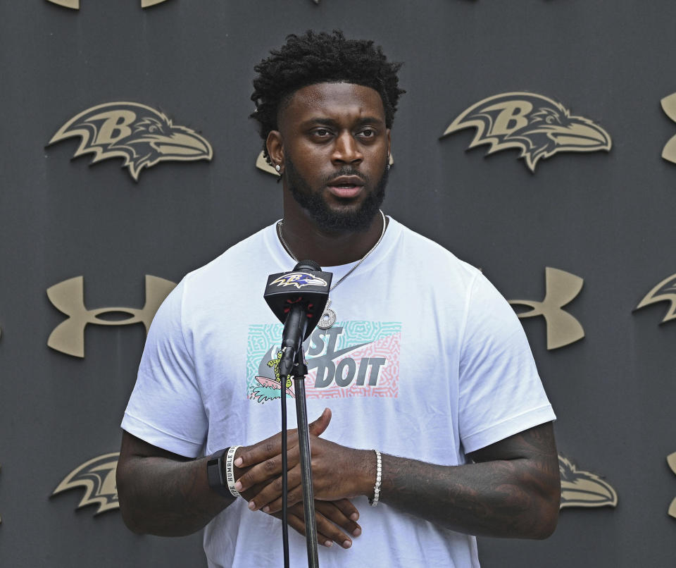 Baltimore Ravens' Patrick Queen speaks with media members at NFL football training camp in Owings Mills, Md., Tuesday, July 26, 2022. (Kenneth K. Lam/The Baltimore Sun via AP)