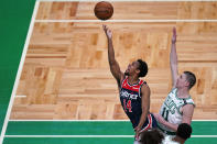 Washington Wizards guard Ish Smith (14) drives to the basket past Boston Celtics guard Payton Pritchard (11) during the first half of an NBA basketball Eastern Conference Play-in game, Tuesday, May 18, 2021, in Boston. (AP Photo/Charles Krupa)