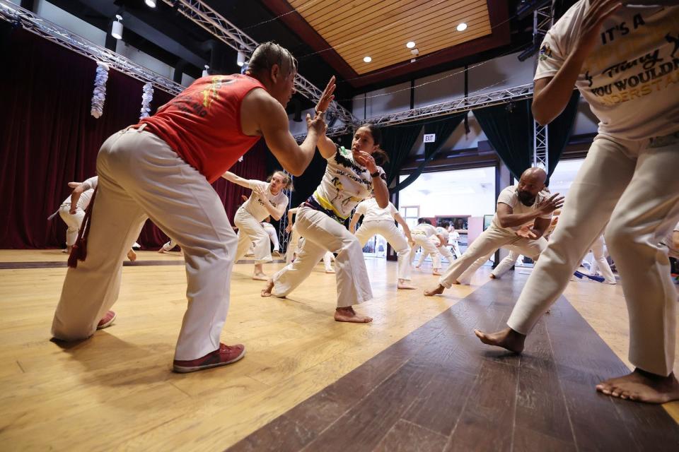 Sandro do Nascimento works with a class during a capoeira class at Trolley Square in Salt Lake City on  April 28. 