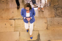 House Speaker Nancy Pelosi walks towards her office at the Capitol to resume talks with White House chief of staff Mark Meadows and Treasury Secretary Steven Mnuchin on a COVID-19 relief bill, Saturday, Aug. 1, 2020, in Washington. (AP Photo/Manuel Balce Ceneta)