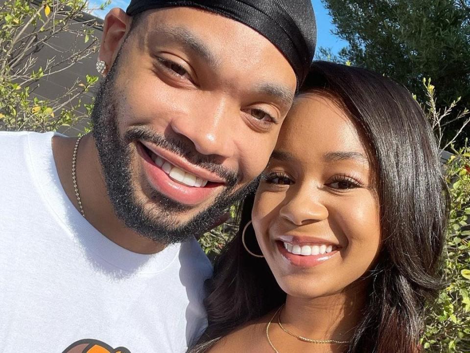 Eric Murphy and Jasmin Lawrence pose together, smiling at the camera, in this selfie.