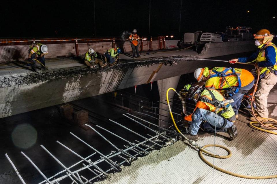 Workers demolish an elevated W-X section of Highway 50 in Sacramento in 2021 at the start of the “Fix 50” project. The gap between the two elevated sections has been filled in to help provide space for new HOV lanes.