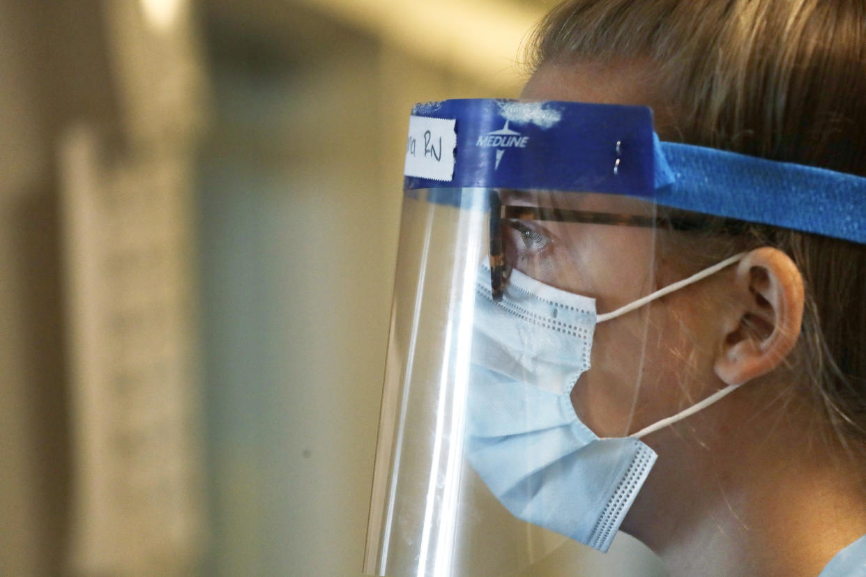 The Centers for Disease Control and Prevention does not recommend wearing face masks, but experts say they may provide better protection overall. (AP Photo/Elaine Thompson)