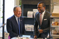 Democratic presidential candidate, former New York Mayor Michael Bloomberg, left, shares a laugh with Richmond mayor Levar Stoney at a coffee shop in Richmond, Va., Tuesday, Jan. 7, 2020. (AP Photo/Steve Helber)
