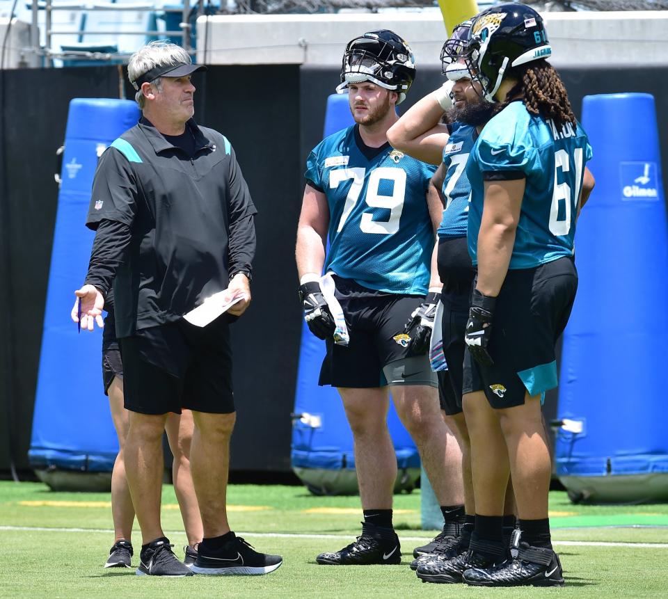Jaguars' head coach Doug Pederson (L) says he wants the five best offensive linemen on the field, which is why he's better off creating legitimate competition for most of the starting jobs.