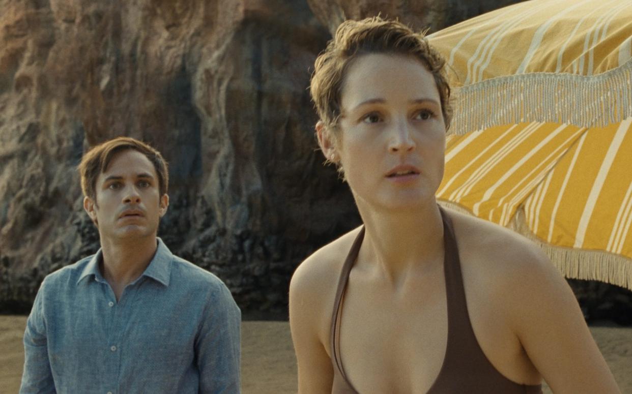 Gael García Bernal and Vicky Krieps discover that their beach holiday is far from idyllic - Universal
