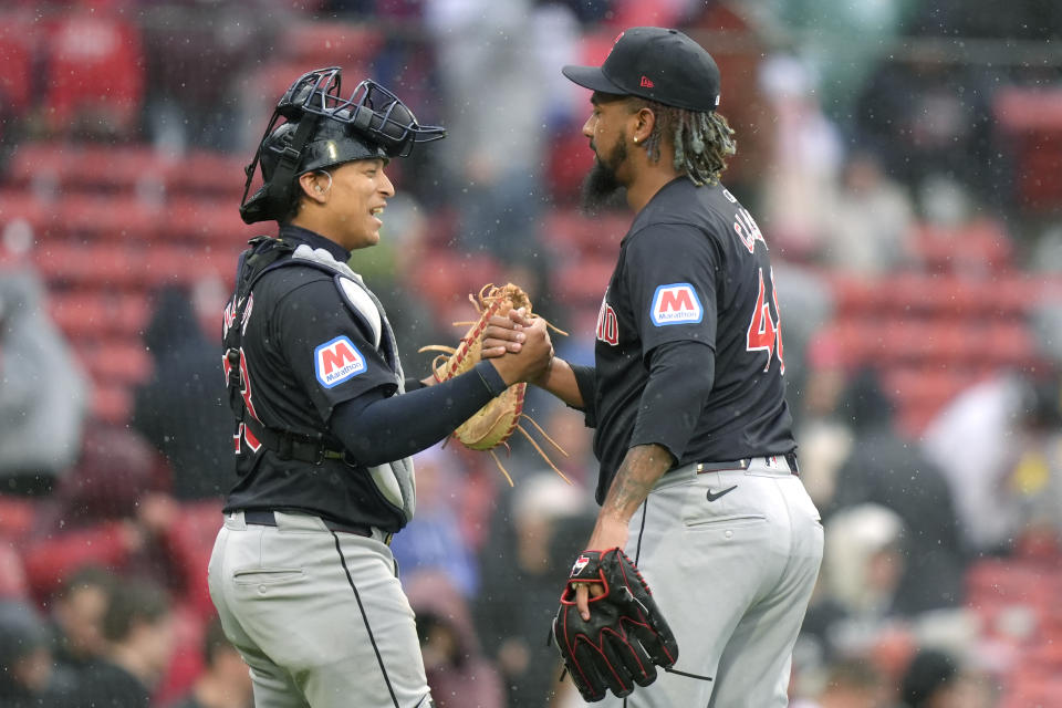 Cleveland Guardians' Bo Naylor, left, celebrates with Emmanuel Clase after Clase struck out Boston Red Sox's Triston Casas to end the baseball game, Thursday, April 18, 2024, in Boston. The Cleveland Guardians beat the Boston Red Sox. (AP Photo/Steven Senne)