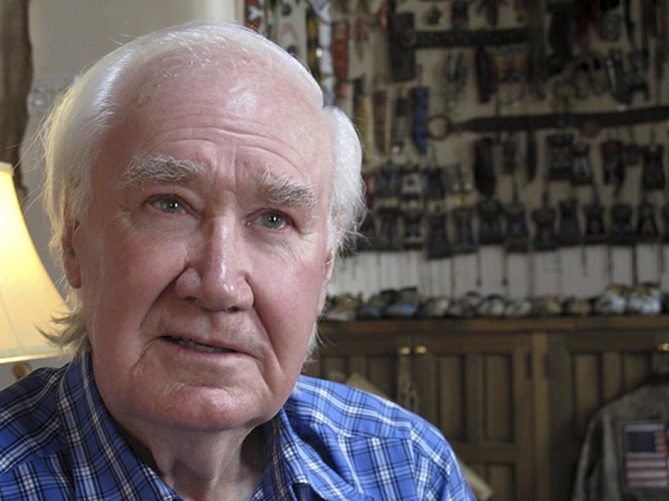 FILE - In this March 22, 2013, file photo, antiquities dealer and author Forrest Fenn sits in his home in Santa Fe, N.M. A bronze chest filled with gold, jewels, and other valuables worth more than $1 million and hidden a decade ago somewhere in the Rocky Mountain wilderness has been found, according to famed art and antiquities collector Fenn who created the treasure hunt. Fenn, 89, told the Santa Fe New Mexican on Sunday, June 7, 2020, that a man who did not want his name released located the chest a few days ago and the discovery was confirmed by a photograph the man sent him. (AP Photo/Jeri Clausing, File)