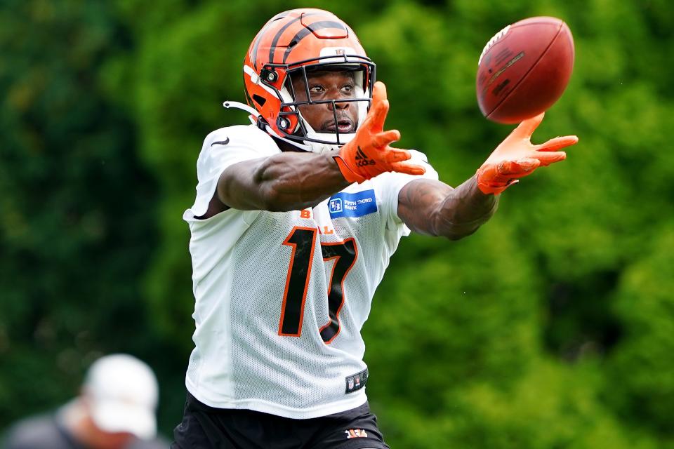 Cincinnati Bengals wide receiver Stanley Morgan (17) catches a pass during training camp practice, Monday, Aug. 16, 2021, at the practice fields next to Paul Brown Stadium in Cincinnati.