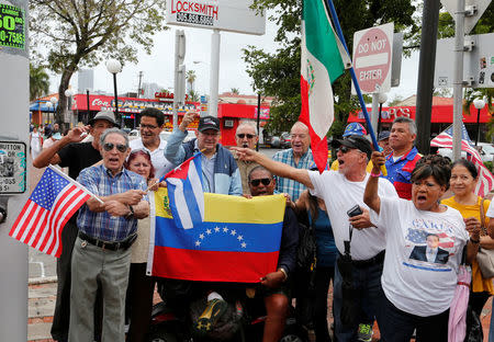 Venezuelans and Cubans take part in a small protest against Venezuelan president Nicolas Maduro as the Venezuelan presidential election is held, in the Little Havana neighborhood in Miami, Florida, U.S., May 20, 2018. REUTERS/Joe Skipper