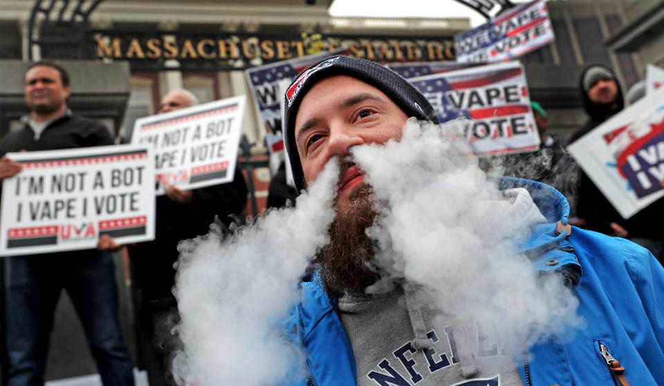 BOSTON, MA - NOVEMBER 19: Anthony Caldalda of Holyoke vapes in protest during a demonstration against Massachusetts Governor Charlie Baker's vaping ban on the front steps of the Massachusetts State House in Boston on Nov. 19, 2019. (Photo by David L. Ryan/The Boston Globe via Getty Images)