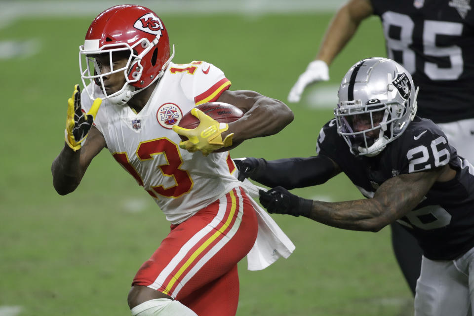 Kansas City Chiefs wide receiver Byron Pringle (13) runs against Las Vegas Raiders cornerback Nevin Lawson (26) during the second half of an NFL football game, Sunday, Nov. 22, 2020, in Las Vegas. (AP Photo/Isaac Brekken)