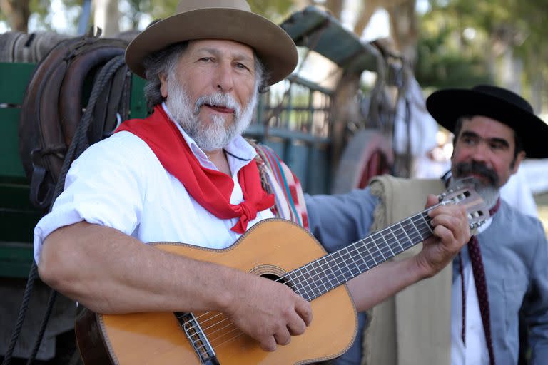 BUENOS AIRES, ARGENTINA - DEC 4: Gauchos playing guitar and singin traditional songs in Gaucho National Day Festival. Dec 4, 2011 in Buenos Aires, Argentina