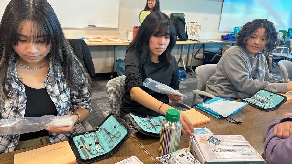 Eleventh grade NACA students practice sutures during a field trip to the University of New Mexico with FACES for the Future Coalition, an organization that helps youth pursue education. - Courtesy Erin Apodaca