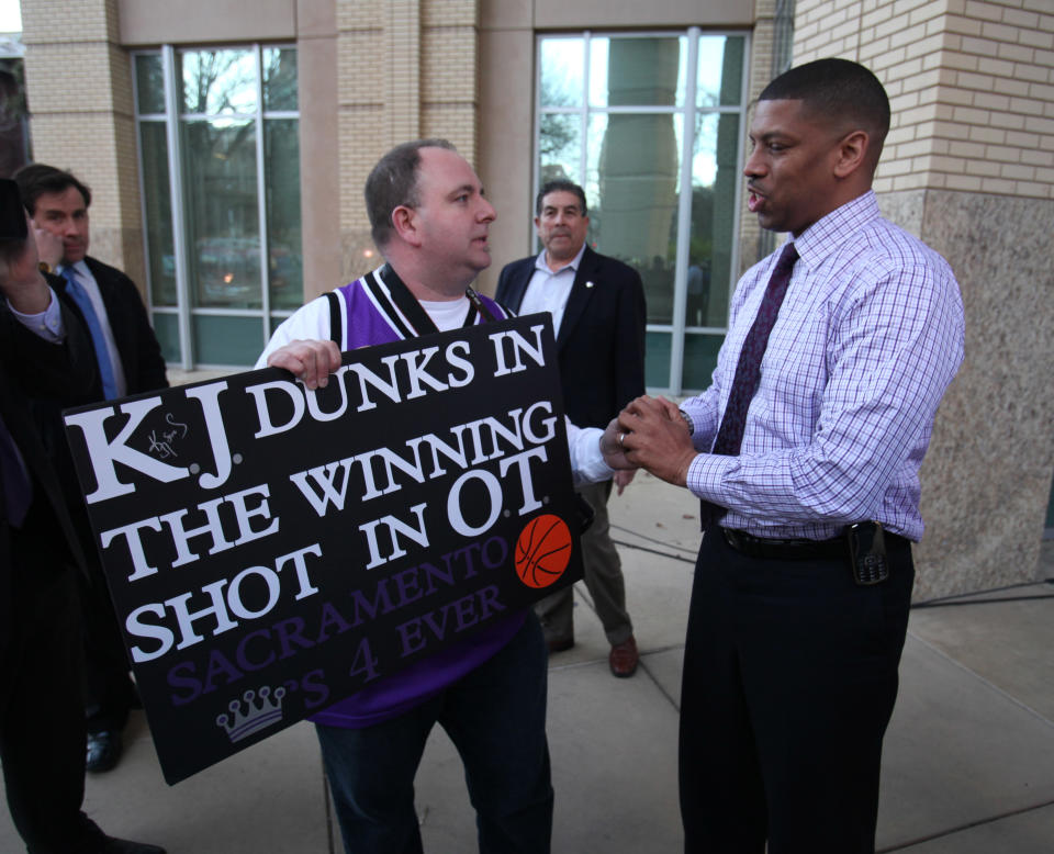 Sacramento Mayor Kevin Johnson, right, thanks Sacramento Kings fan Shawn Jonas for his support prior to the Sacramento City Council meeting, where a vote will be taken on a new sports arena proposal, in Sacramento, Calif. Tuesday, March 6, 2012. A year after almost being wiped off the NBA basketball map, Sacramento can secure its place in the league when the City Council votes on a plan to help finance a $391-million arena. Approval would keep the Kings where they are for at least another 30 years. (AP Photo/Rich Pedroncelli)