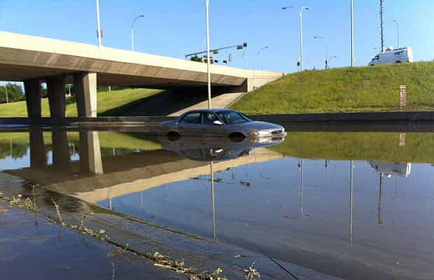 A car sits on Whitemud Drive following a storm that pounded south Edmonton with hail and heavy rain on July 12, 2012.