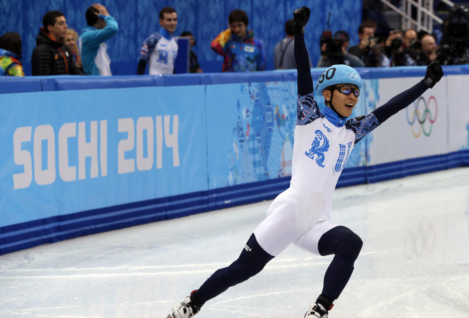 Russia's Victor An celebrates after winnning with his team the gold medal in the Men's Short Track 5000 m Relay Final at the Iceberg Skating Palace during the Sochi Winter Olympics on February 21, 2014. AFP PHOTO / ADRIAN DENNIS        (Photo credit should read ADRIAN DENNIS/AFP/Getty Images)