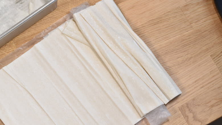 phyllo dough layers on wooden table