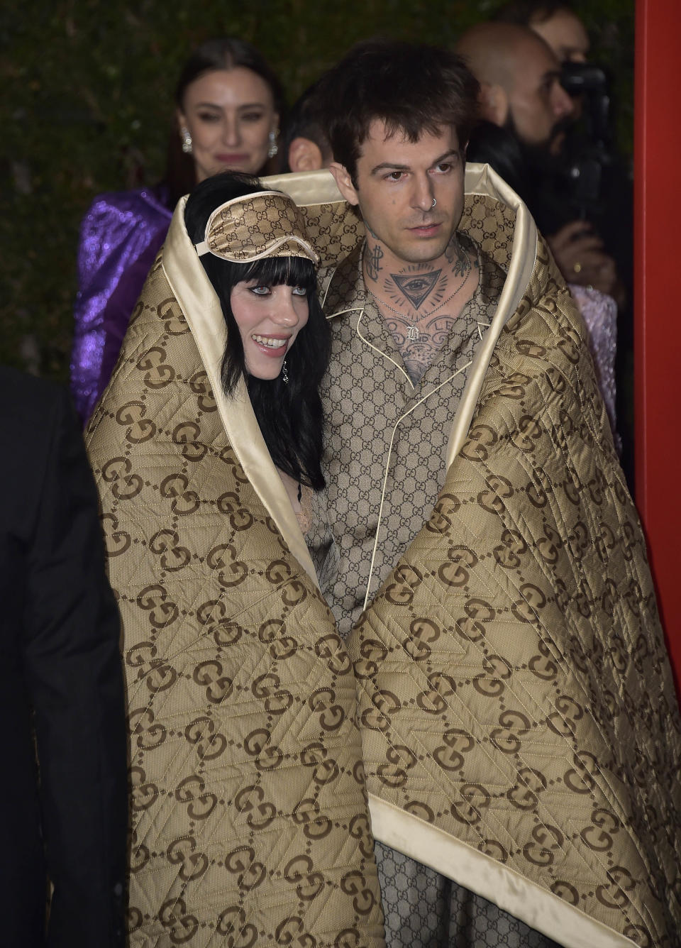 the two at an event under a blanket