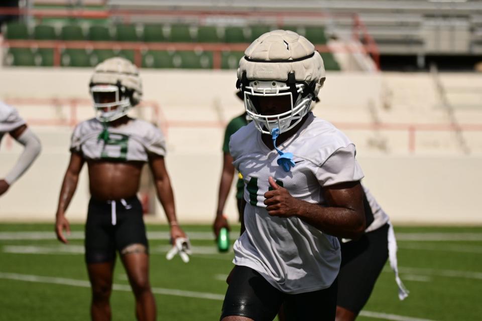 Florida A&M University cornerback B.J. Bohler (11) goes through a drill during fall practice, July 30, 2022