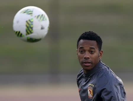 Guangzhou Evergrande's Robinho eyes the ball during a training session ahead of their Club World Cup semi-final soccer match against Barcelona in Yokohama, south of Tokyo, Japan, December 15, 2015. REUTERS/Toru Hanai/Files