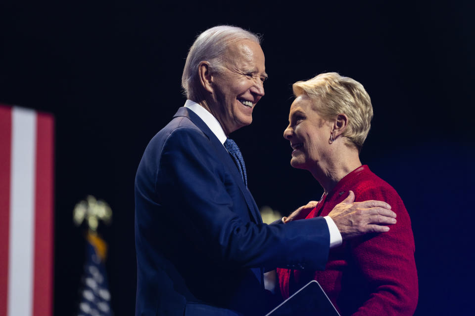 Cindy McCain, wife of late Sen. John McCain, greets President Joe Biden as he arrives to deliver remarks on democracy and honoring the legacy of Sen. McCain at the Tempe Center for the Arts, Thursday, Sept. 28, 2023, in Tempe, Ariz. (AP Photo/Evan Vucci)