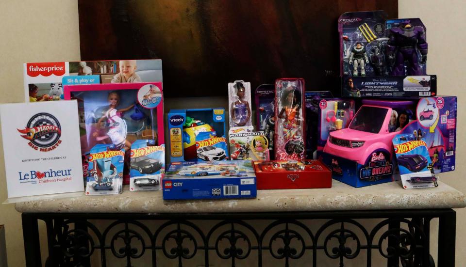 Brand-new donated toys sit on a table inside Pinnacle Financial for Shaun Smith’s Little Wheels Big Hearts of Tennessee toy drive for Le Bonheur Children’s Hospital at the Poplar and Highland location on Wednesday November 15, 2023 in Memphis, Tenn.