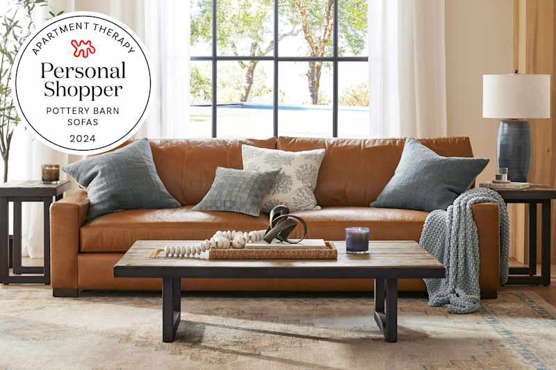 Pottery Barn living room with brown leather sofa. Seal in upper left corner reads "Apartment Therapy Personal Shopper Pottery Barn Sofas 2024"