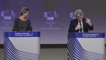 European Commissioner for Europe fit for the Digital Age Margrethe Vestager, left, and European Commissioner in charge of internal market Thierry Breton participate in a media conference on an EU approach to artificial intelligence, following a weekly meeting of EU Commissioners, at EU headquarters in Brussels, Wednesday, April 21, 2021. (Olivier Hoslet, Pool via AP)