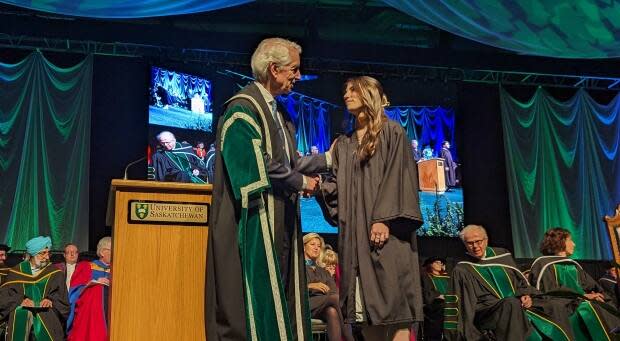 Kennedy Marley shakes hands with University of Saskatchewan president Peter Stoicheff as she crosses the stage at a convocation ceremony in Saskatoon's Merlis Belsher Place on Wednesday.