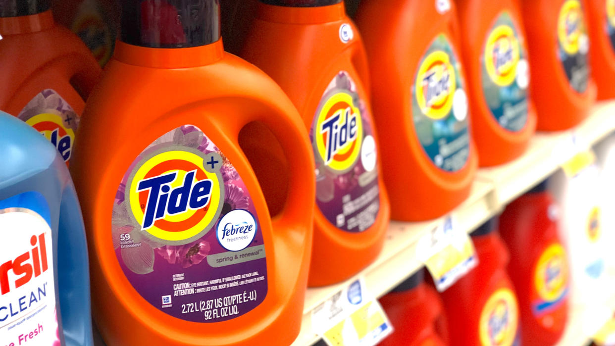 Harlan, KY / USA - July 17, 2019: Tide brand detergent with added Febreze freshener in plastic bottles on the shelf at a local grocery store.