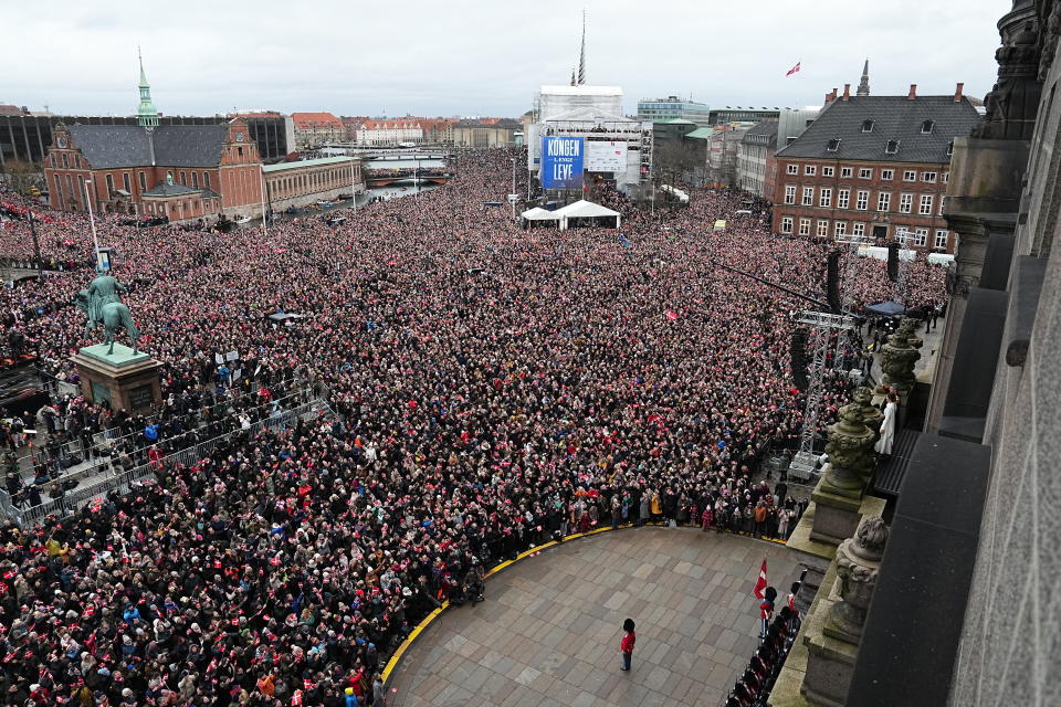 Denmark's King Frederik X and Queen Mary wave to the crowd on the balcony, after the proclamation, at Christiansborg Palace, in Copenhagen, Sunday, Jan. 14, 2024. Denmark’s prime minister proclaimed Frederik X as king after his mother Queen Margrethe II formally signed her abdication. Massive crowds turned out to rejoice in the throne passing from a beloved monarch to her popular son. (Mads Claus Rasmussen/Ritzau Scanpix via AP)