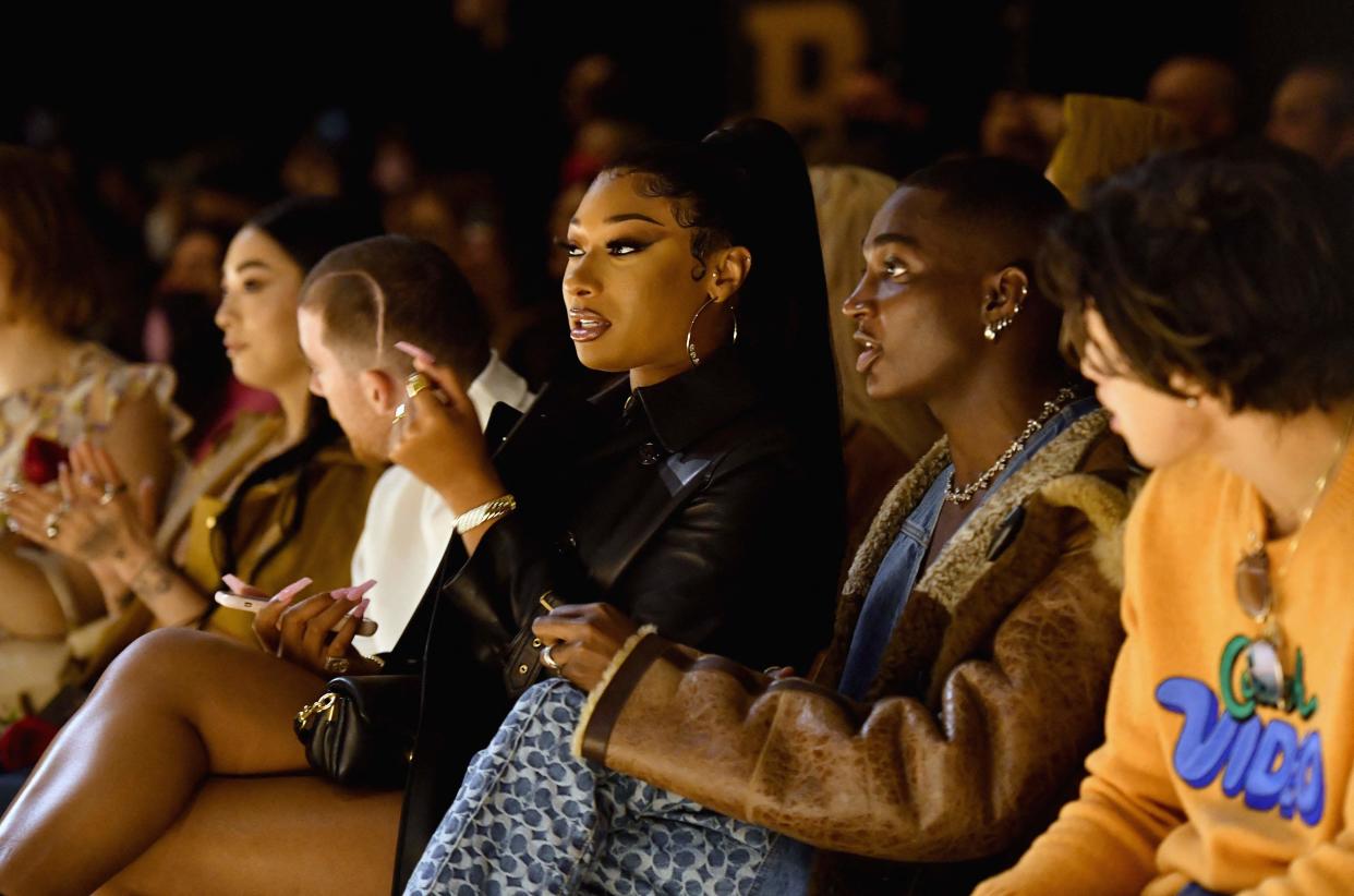 Megan Thee Stallion, Angus Cloud, Rickey Thompson and Charles Melton attend the Coach runway show during New York Fashion Week in New York City on Feb. 14, 2022.