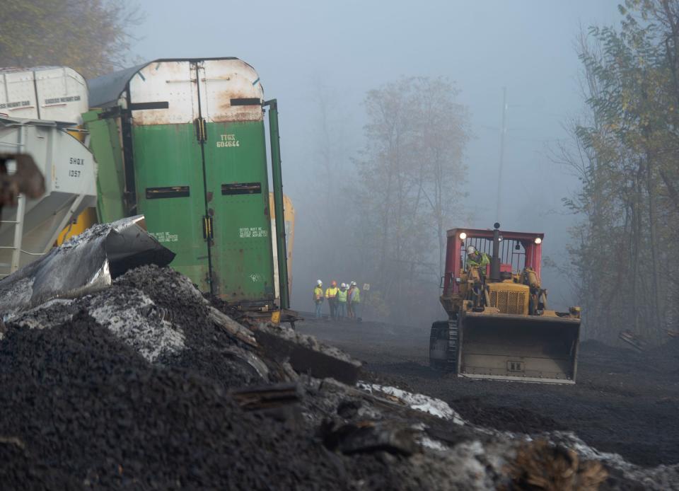 A bulldozer removes tracks from the Ravenna Township derailment site on Nov. 2.