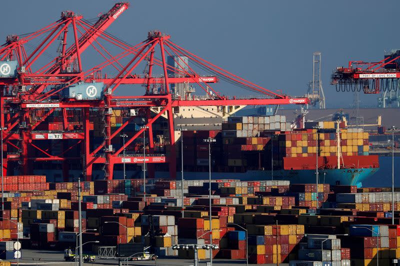 FILE PHOTO: Ships and shipping containers are pictured at the port of Long Beach in Long Beach, California