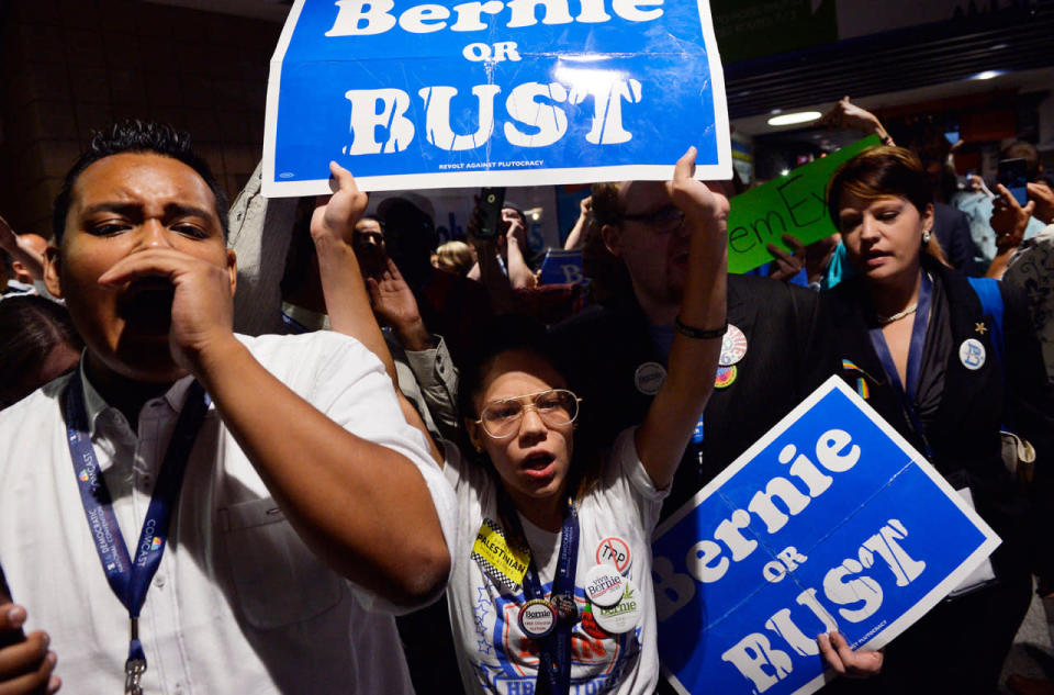 <p>Supporters of former Democratic Presidential candidate Senator Bernie Sanders walk out in protest after he moved to suspend the rules and nominate Hillary Clinton during the Democratic National Convention in Philadelphia, Pa., July 26, 2016. (Photo: Charles Mostoller/Reuters)</p>