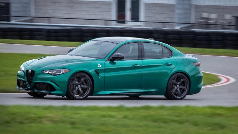 Front 3/4 view of a green Alfa Romeo Giulia Quadrifoglio on track